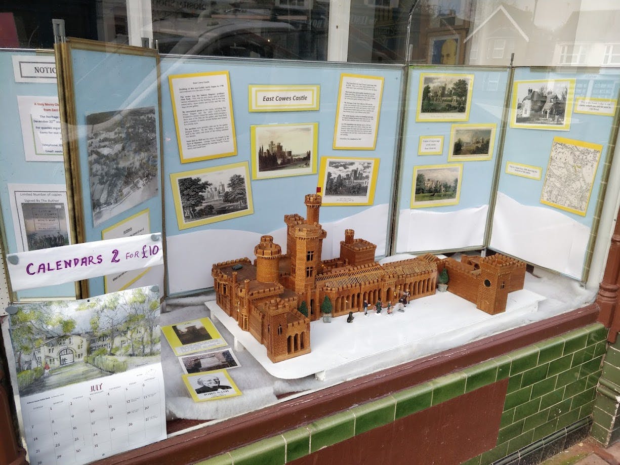 The exhibition in the window shows east cowes castle, before it's destruction