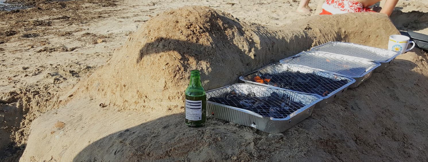A beach kitchen dug into the sand at Colwell Bay